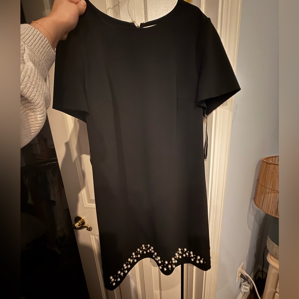 Calvin Klein black dress with pearl bottom. In great condition